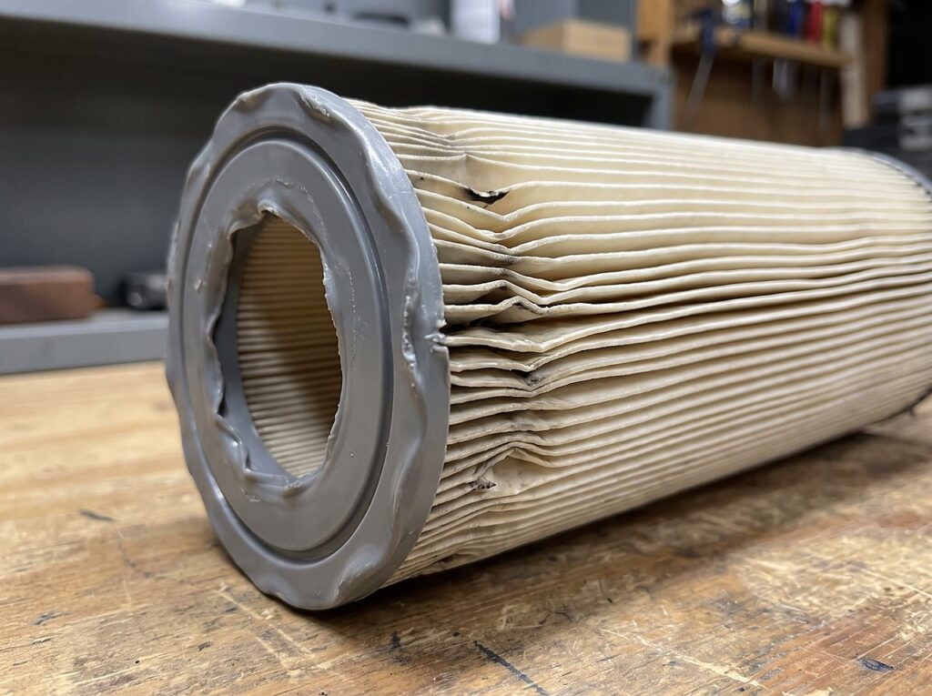 spa filter end cap warped and pleats crushed from improper heat exposure