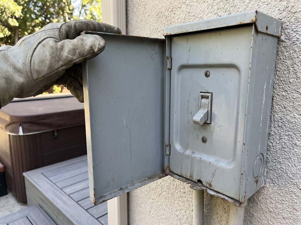 an exterior breaker switch flipped off before draining a hot tub