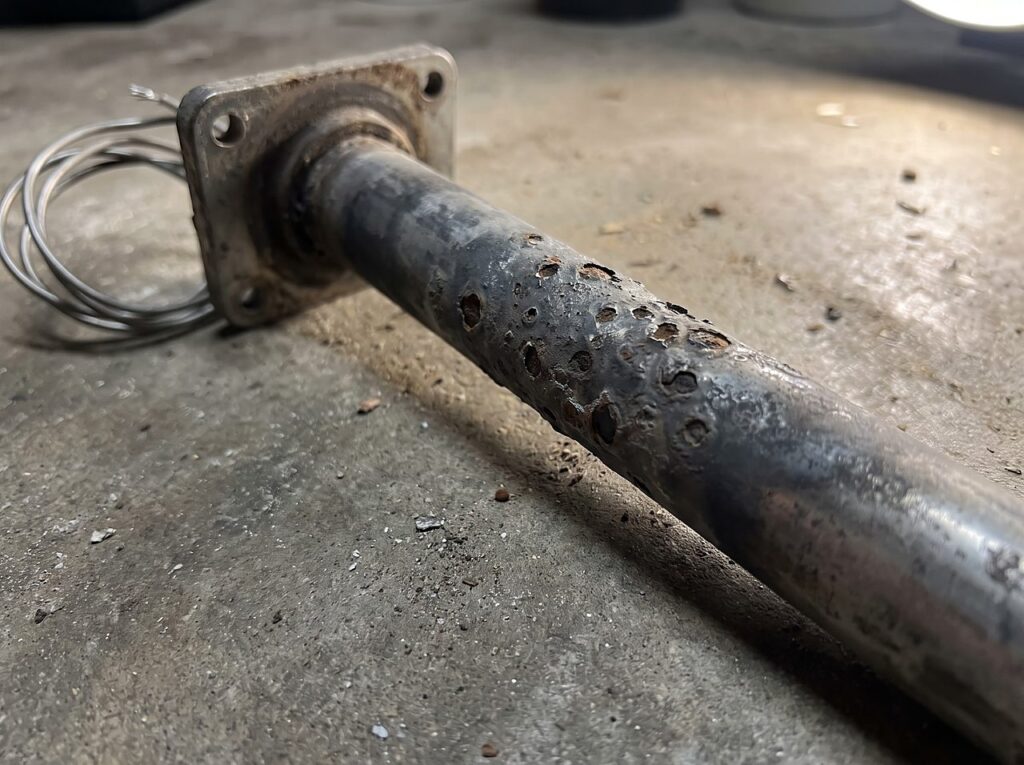 pitted corrosion on a removed spa heater element from mineral exposure