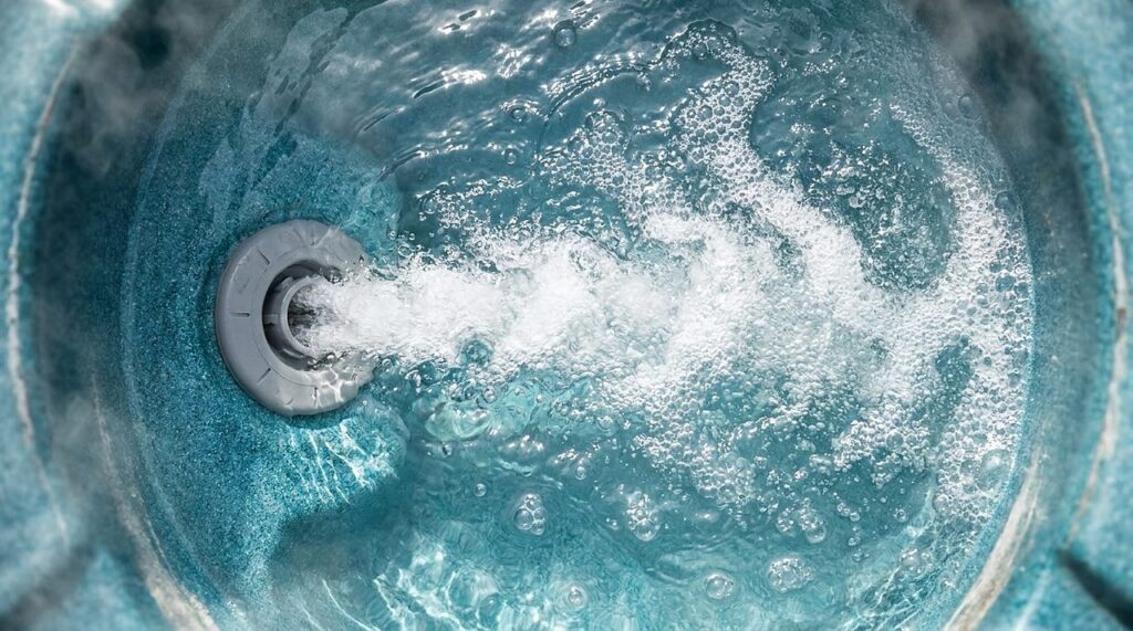 bubbling hot tub jet at the water surface during normal operation